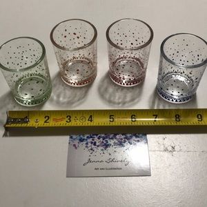 Set of four hand painted votive candle holders